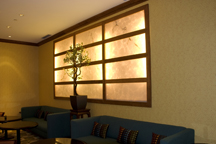 Custom millwork framing for backlighted window feature in Hotel lounge.