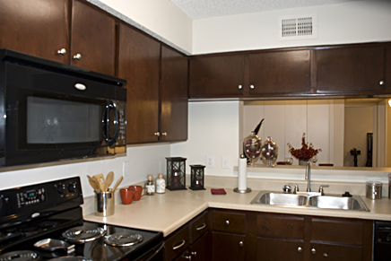 Commercial Apartment Kitchen Remodeling with cabinet refinishing and refacing and countertop resurfacing