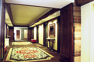 Guest floor elevator lobby remodeling in 'world class' hotel features fine craftsmanship in paneling and molding renovations.
