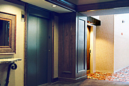 Custom woodworking and installation of paneling, crown modling, and baseboards for hotel's elevator vestibules.