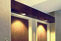 Special wood crafted guest room entrance headers were custom built to hold recessed lighting and add distinctive ambience for hotel guests.