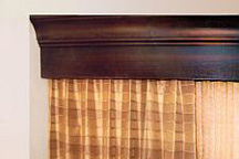 Custom-built curtain valences in crown molding style feature crafted millwork and were installed in hotel guest rooms.