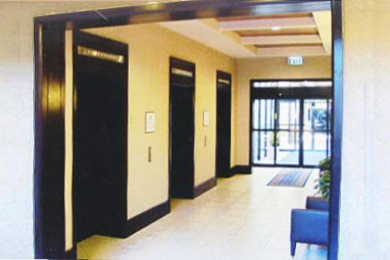 Elevator entrance and lobby doorway custom millwork molding and installation by Bonier.