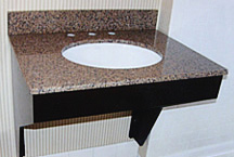 Custom designed and constructed 'special needs' vanity with cut-away base and granite countertop for hotel's 'special needs' guests.